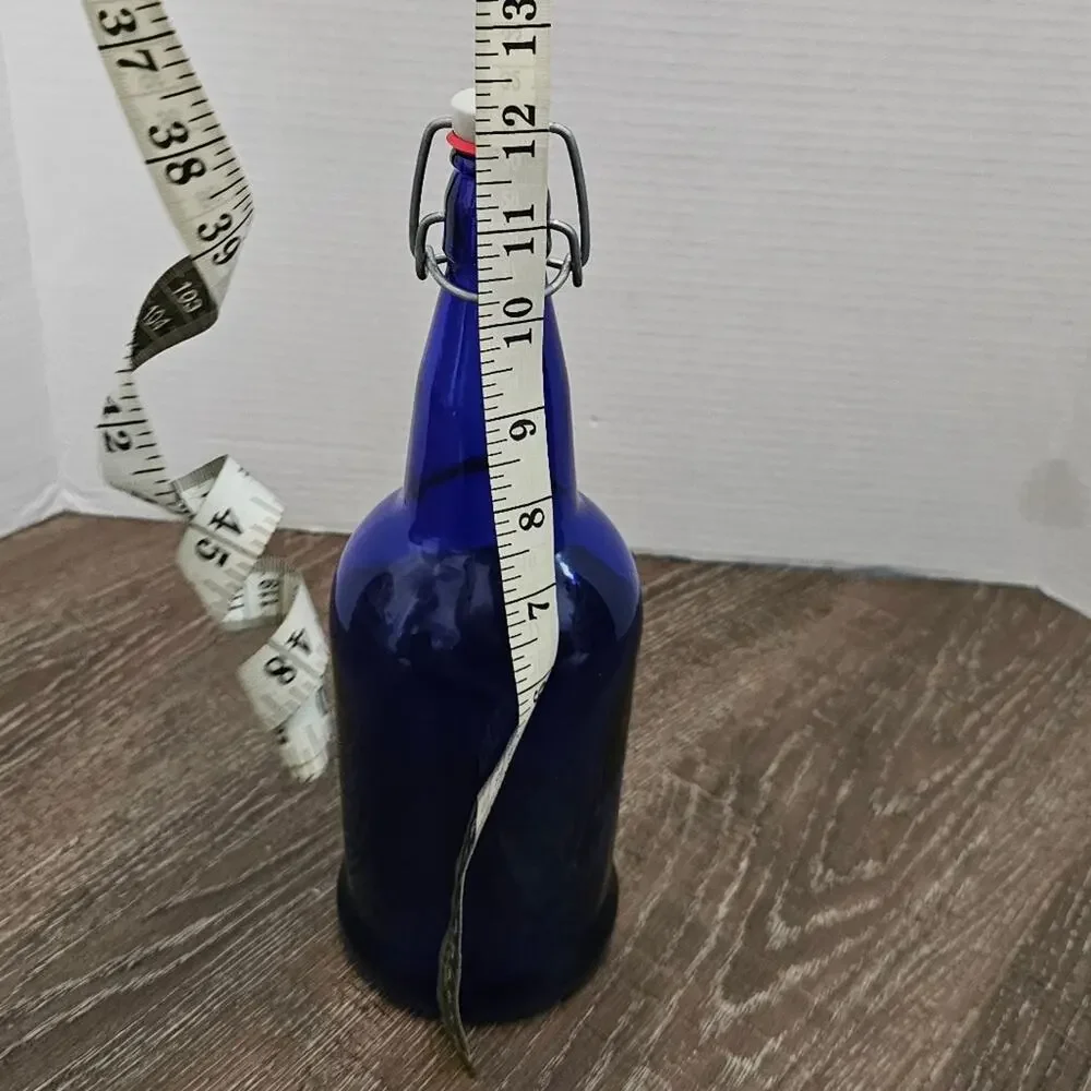 VINTAGE GROLSCH COBALT BLUE GLASS BOTTLE W/FLIP TOP STOPPER‎